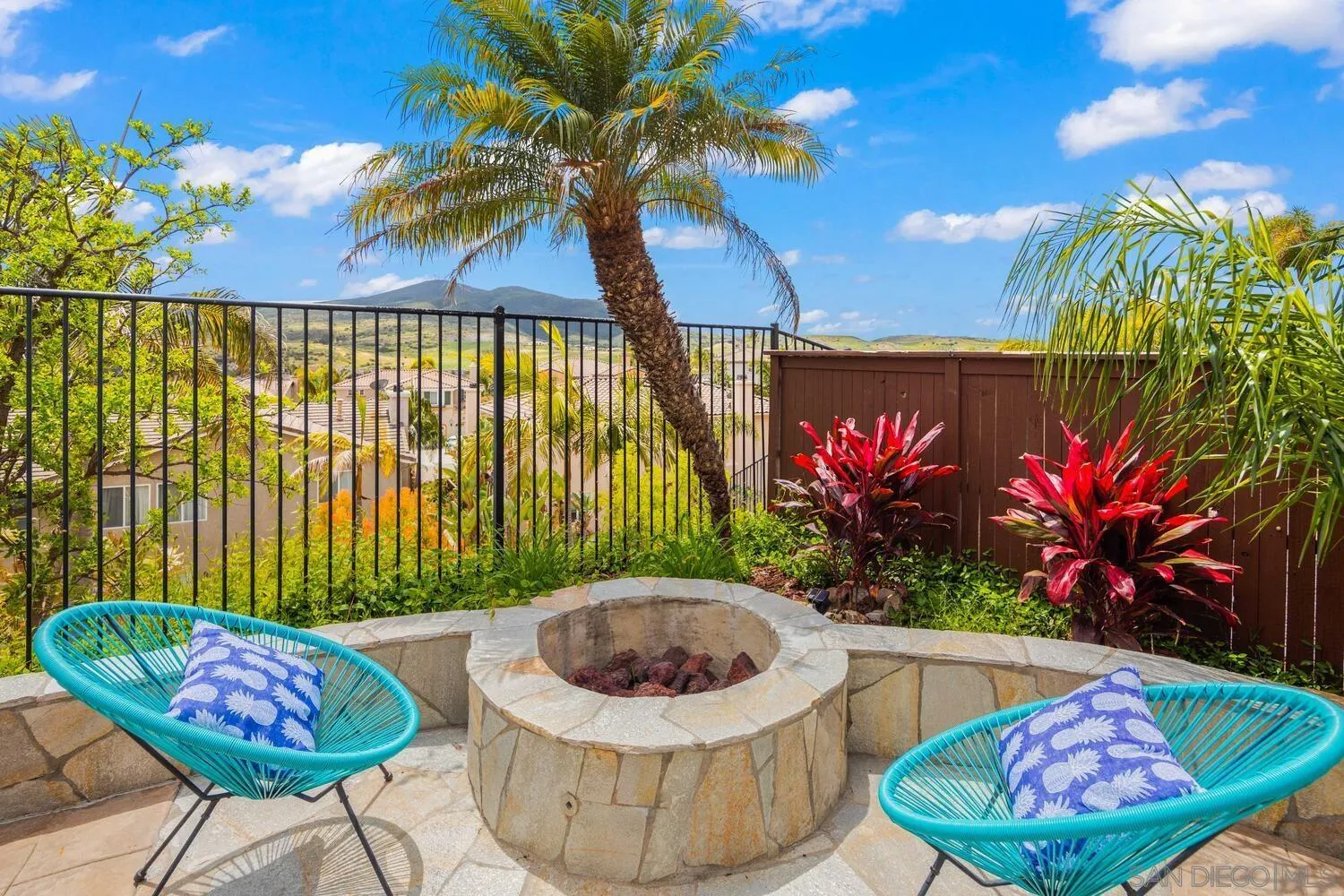 16327 Pinto Ridge Drive 4S Ranch, CA 92127 - Photo 59 of 74 a view of a chairs and table in a backyard