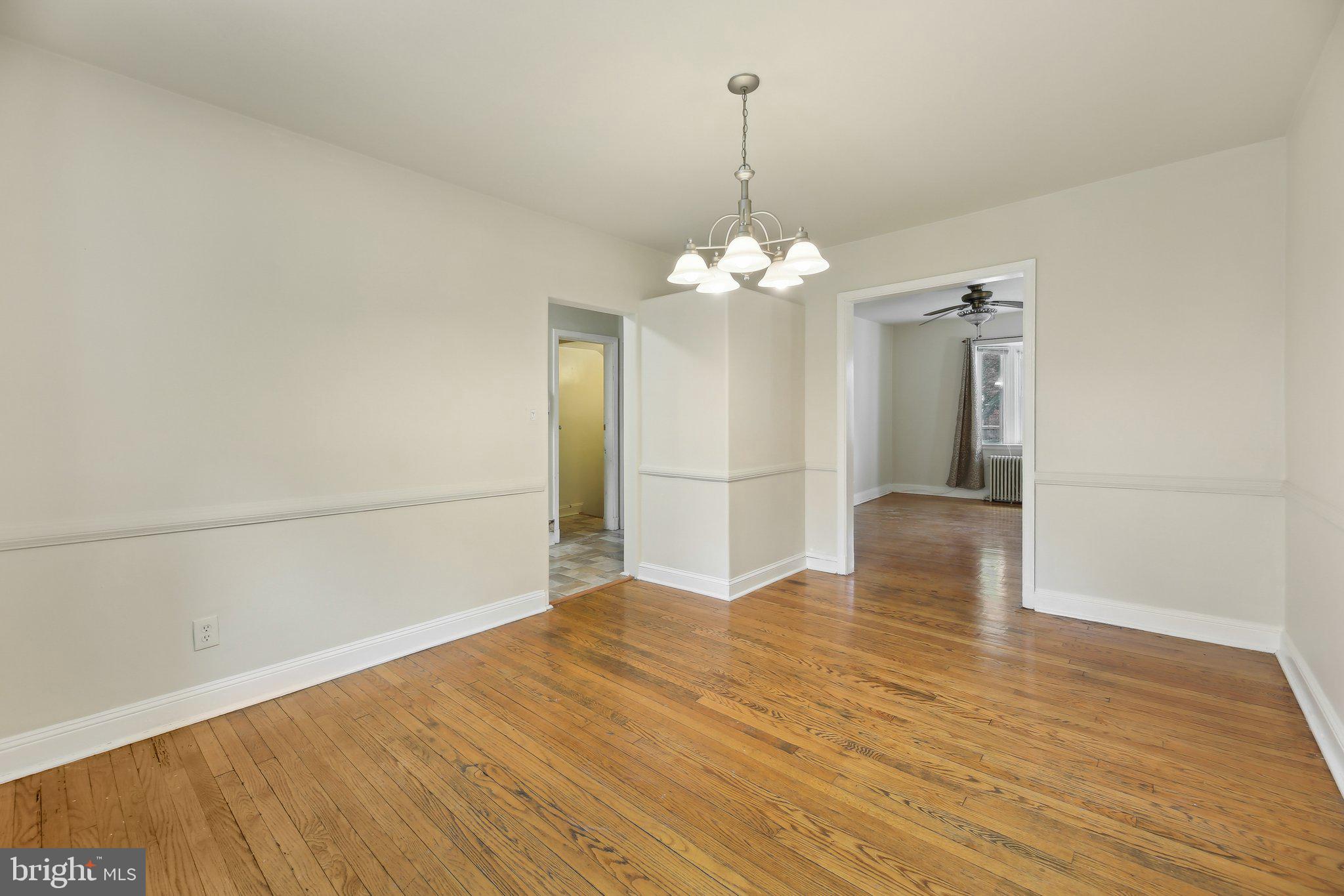 5509 Lothian Road Baltimore, MD 21212 - Photo 11 of 31 a view of a livingroom with a chandelier