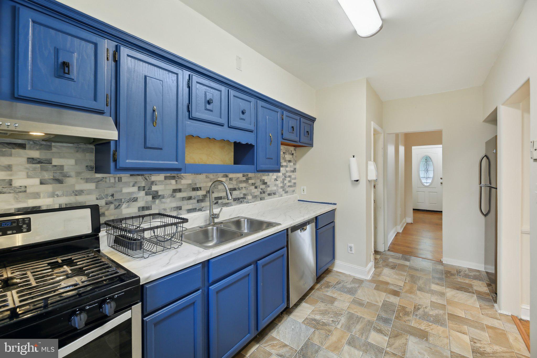 5509 Lothian Road Baltimore, MD 21212 - Photo 13 of 31 a kitchen with a stove and a sink