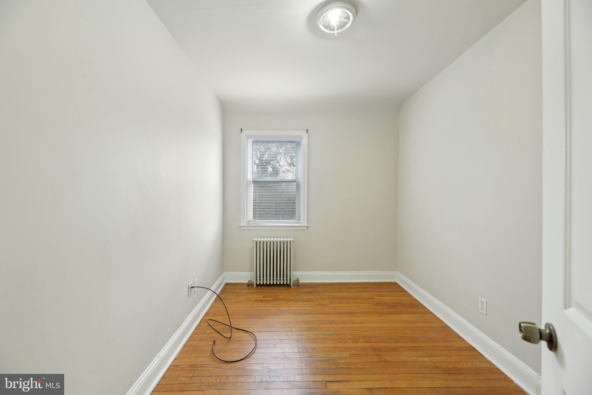 5509 Lothian Road Baltimore, MD 21212 - Photo 20 of 31 a view of empty room with wooden floor
