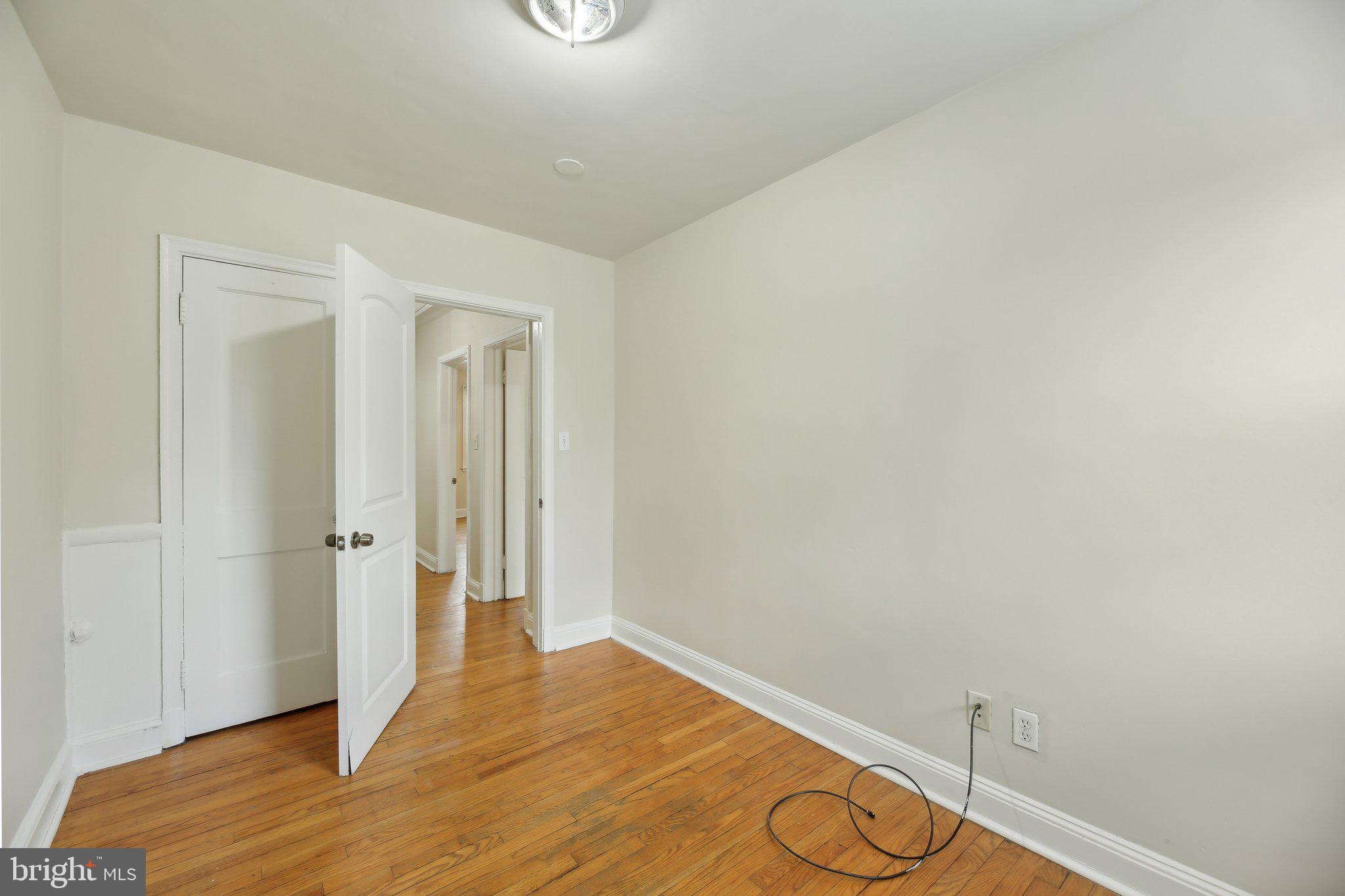 5509 Lothian Road Baltimore, MD 21212 - Photo 21 of 31 a view of empty room with wooden floor