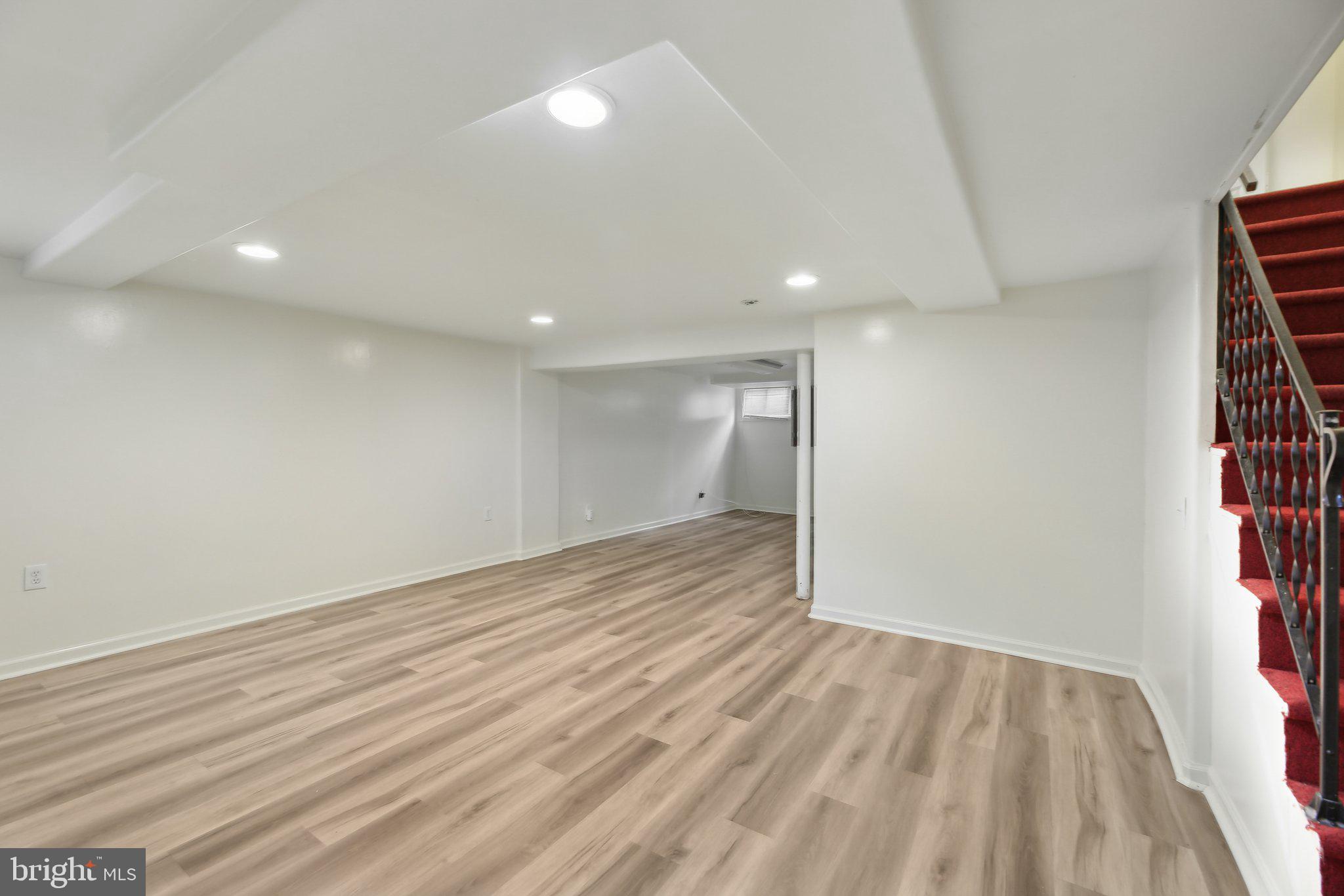 5509 Lothian Road Baltimore, MD 21212 - Photo 22 of 31 wooden floor in an empty room with a window