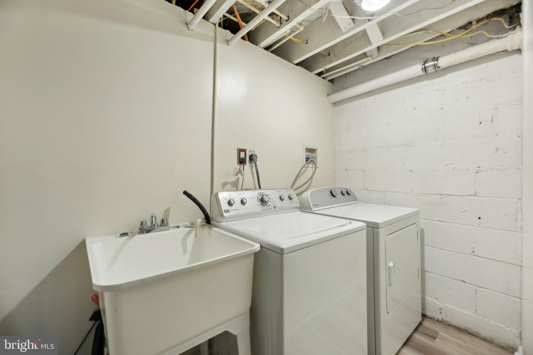 5509 Lothian Road Baltimore, MD 21212 - Photo 26 of 31 a utility room with a sink dryer and washer