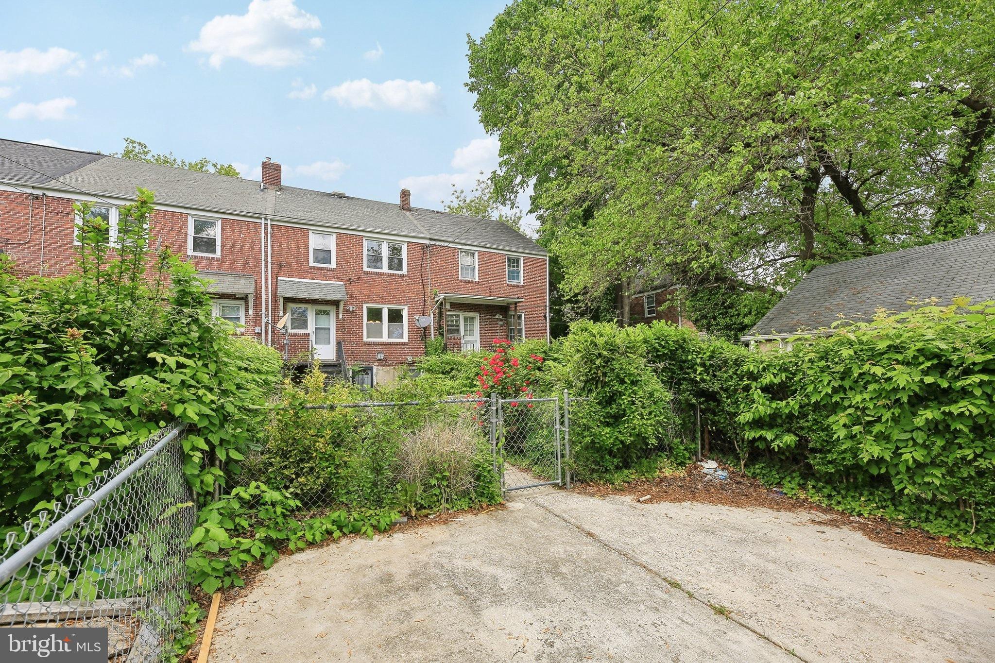 5509 Lothian Road Baltimore, MD 21212 - Photo 30 of 31 a front view of a house with a yard and trees