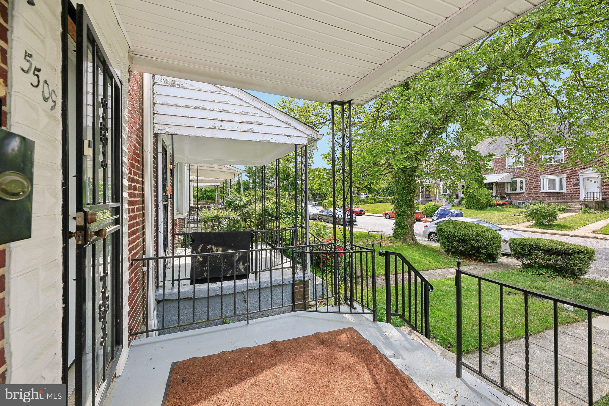 5509 Lothian Road Baltimore, MD 21212 - Photo 4 of 31 a view of a porch with a floor to ceiling window and a balcony