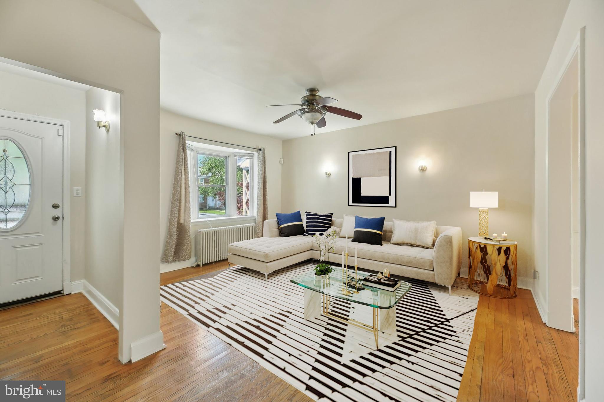 5509 Lothian Road Baltimore, MD 21212 - Photo 7 of 31 a living room with furniture and a wooden floor