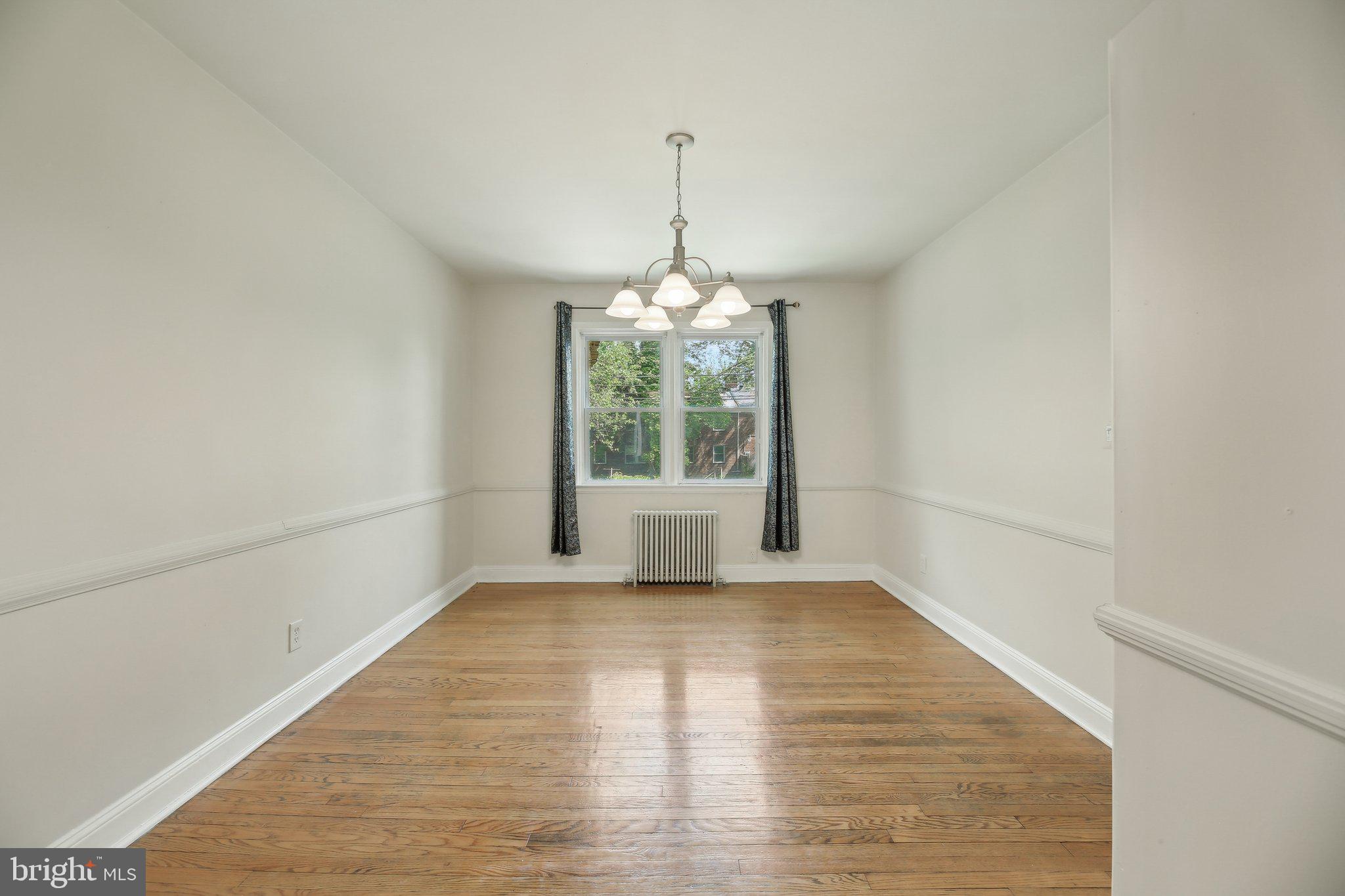 5509 Lothian Road Baltimore, MD 21212 - Photo 9 of 31 a view of a room with window and wooden floor