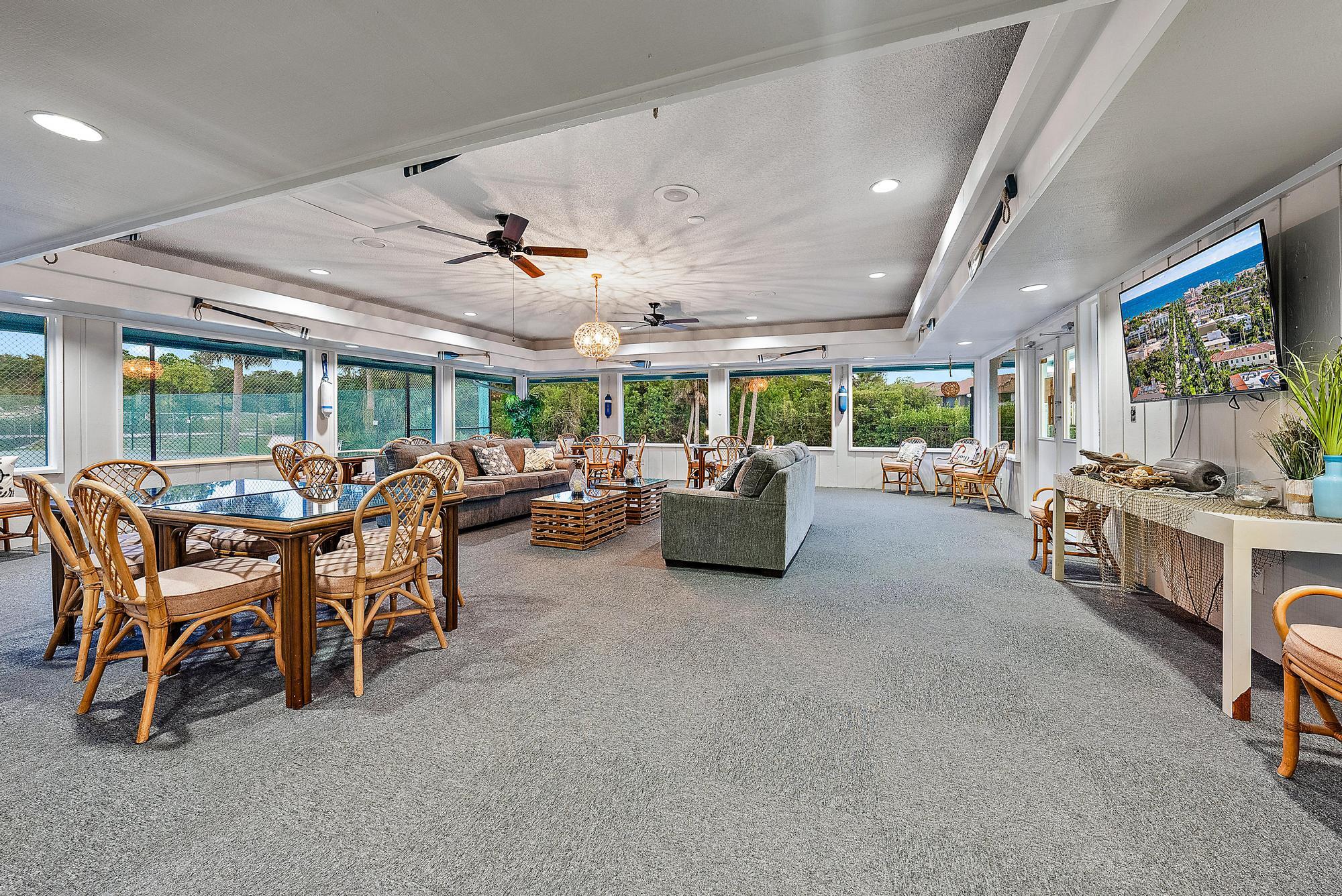 1561 Northeast 12th Terrace, Unit C14 Jensen Beach, FL 34957 - Photo 25 of 27 a living room with furniture and a large window