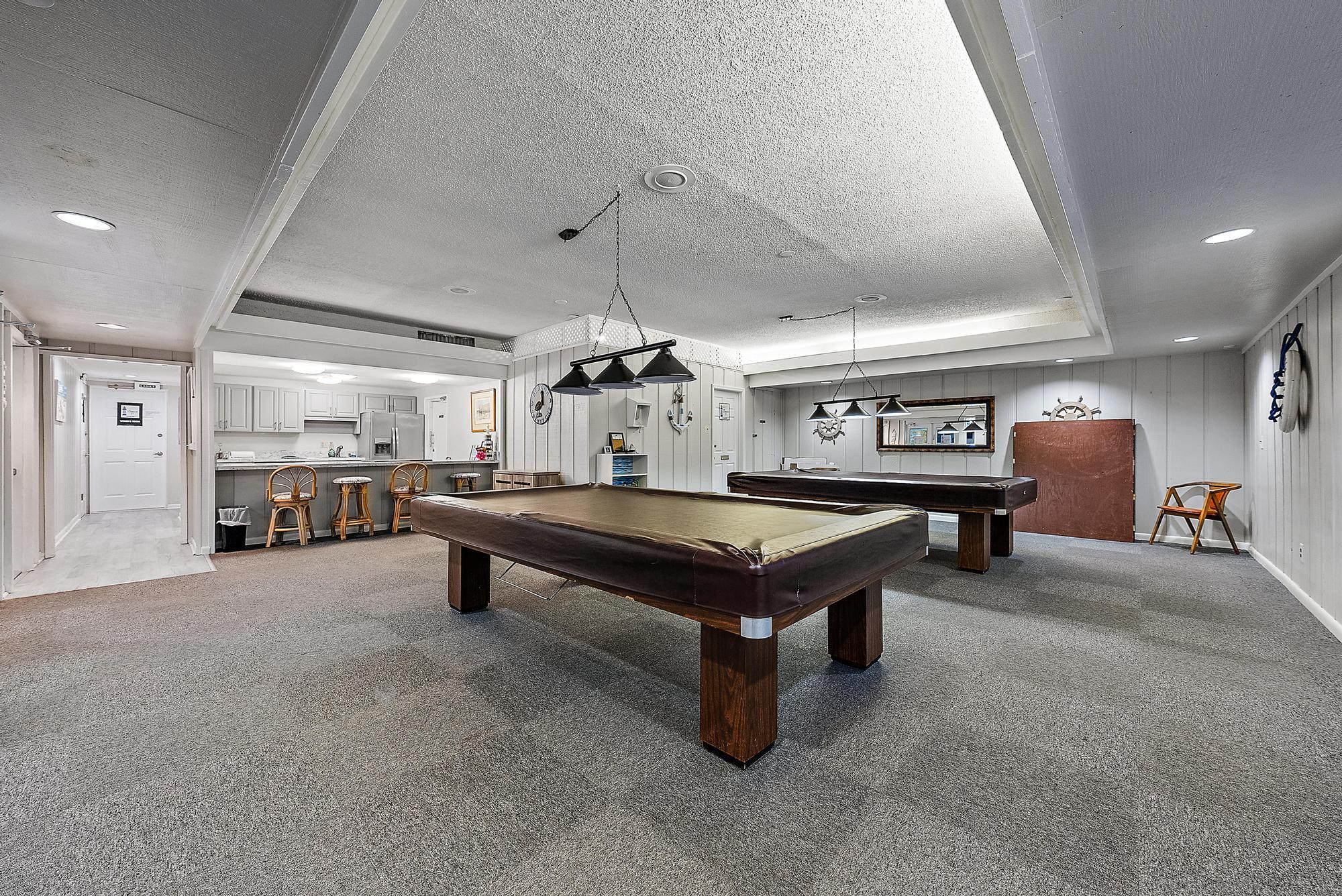 1561 Northeast 12th Terrace, Unit C14 Jensen Beach, FL 34957 - Photo 26 of 27 a room with furniture and a table