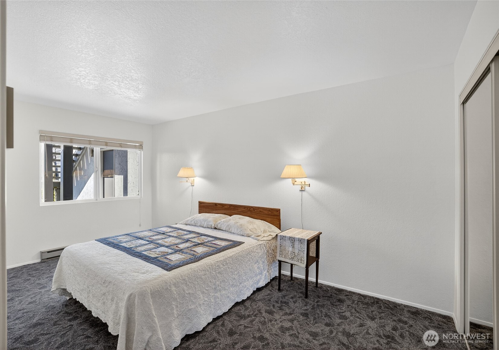 2001 Skyline Way, Unit 103 Anacortes, WA 98221 - Photo 11 of 39 a bedroom with a bed and a window