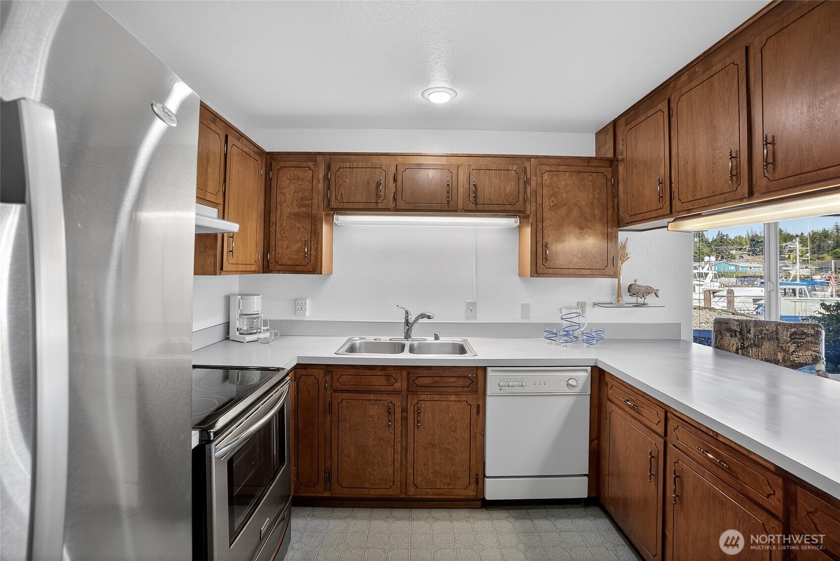 2001 Skyline Way, Unit 103 Anacortes, WA 98221 - Photo 16 of 39 a kitchen with a sink stove and cabinets