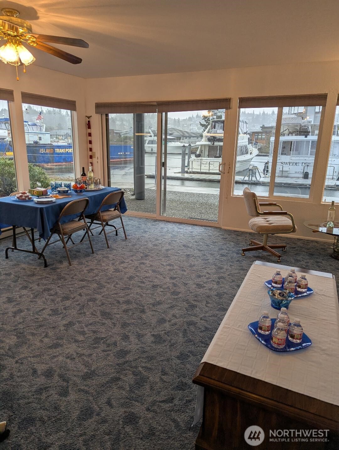 2001 Skyline Way, Unit 103 Anacortes, WA 98221 - Photo 20 of 39 a living room with furniture and a floor to ceiling window