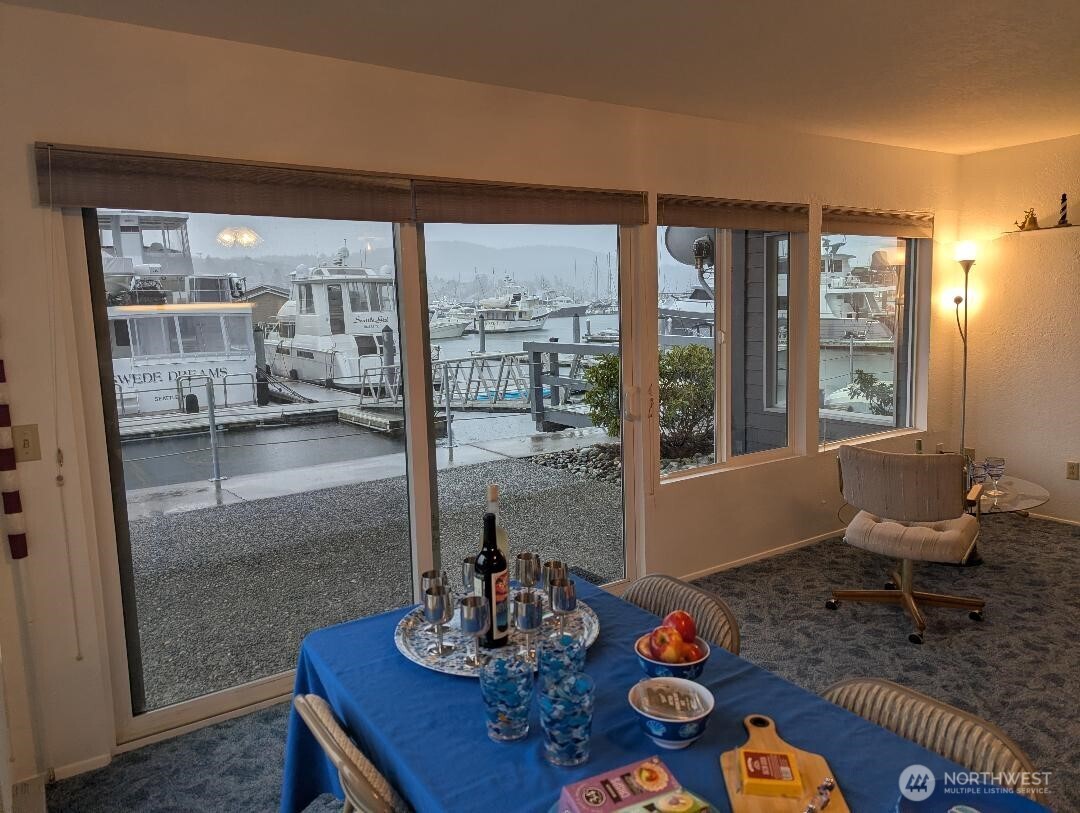 2001 Skyline Way, Unit 103 Anacortes, WA 98221 - Photo 21 of 39 a living room with furniture and a floor to ceiling window