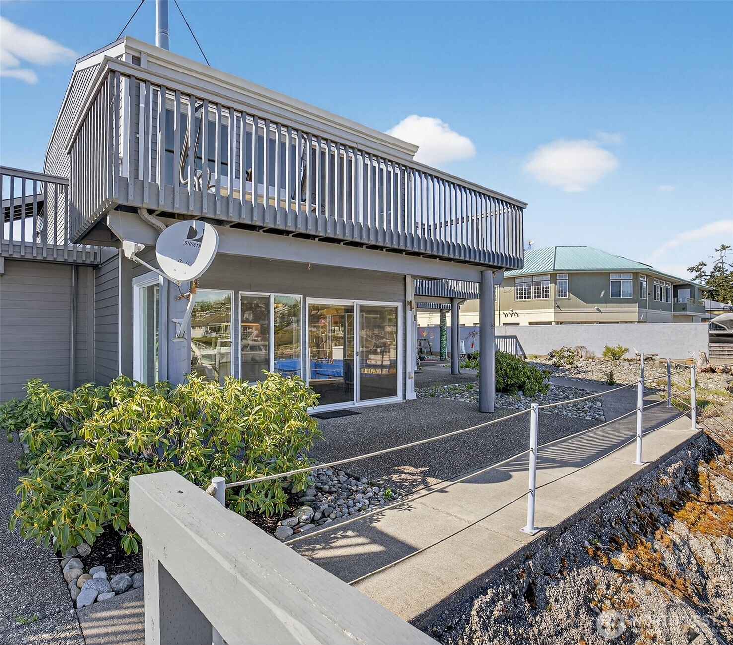 2001 Skyline Way, Unit 103 Anacortes, WA 98221 - Photo 25 of 39 a front view of a house with a porch