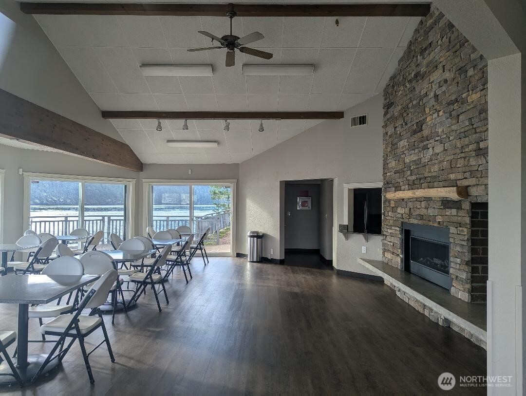 2001 Skyline Way, Unit 103 Anacortes, WA 98221 - Photo 35 of 39 a living room with furniture a fireplace and wooden floor
