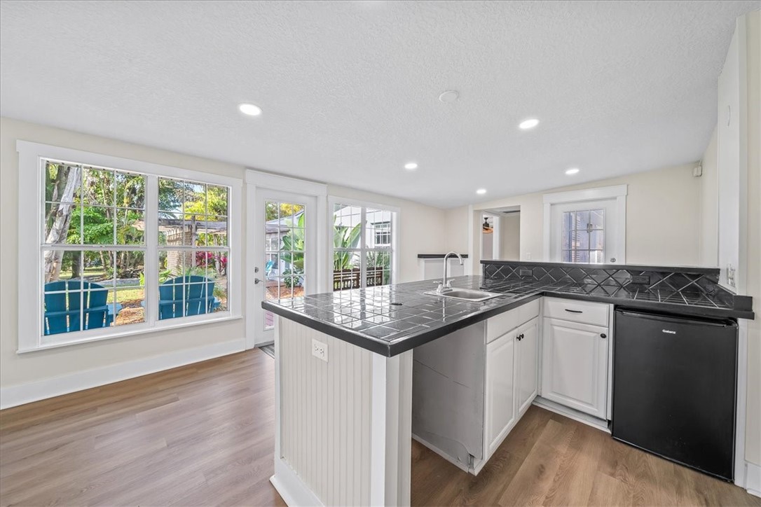 9670 Mockingbird Lane Sebastian, FL 32976 - Photo 11 of 36 a kitchen with a sink and large window