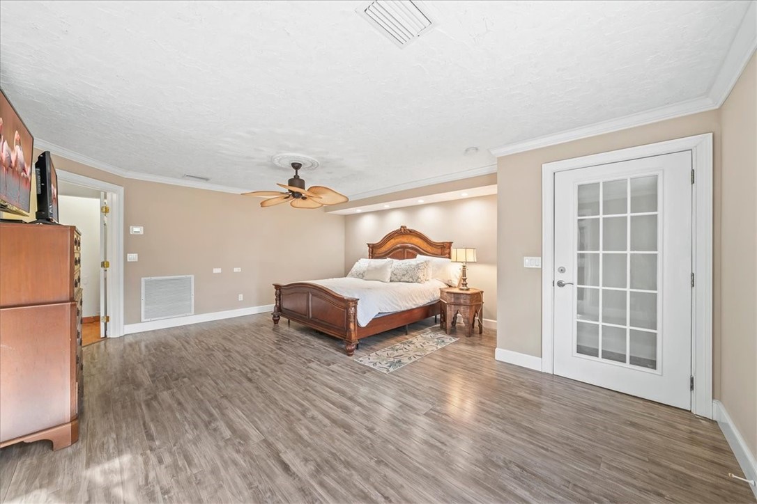 9670 Mockingbird Lane Sebastian, FL 32976 - Photo 13 of 36 a bedroom with furniture and a window