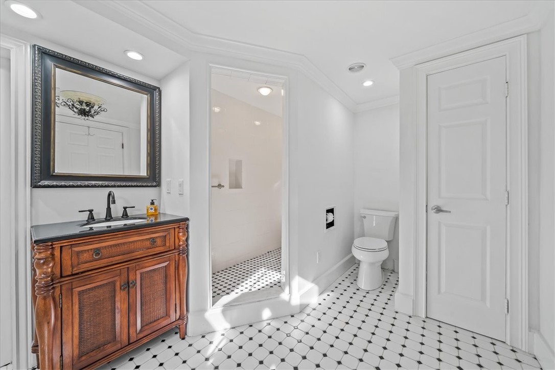 9670 Mockingbird Lane Sebastian, FL 32976 - Photo 15 of 36 a bathroom with a toilet a sink and a mirror