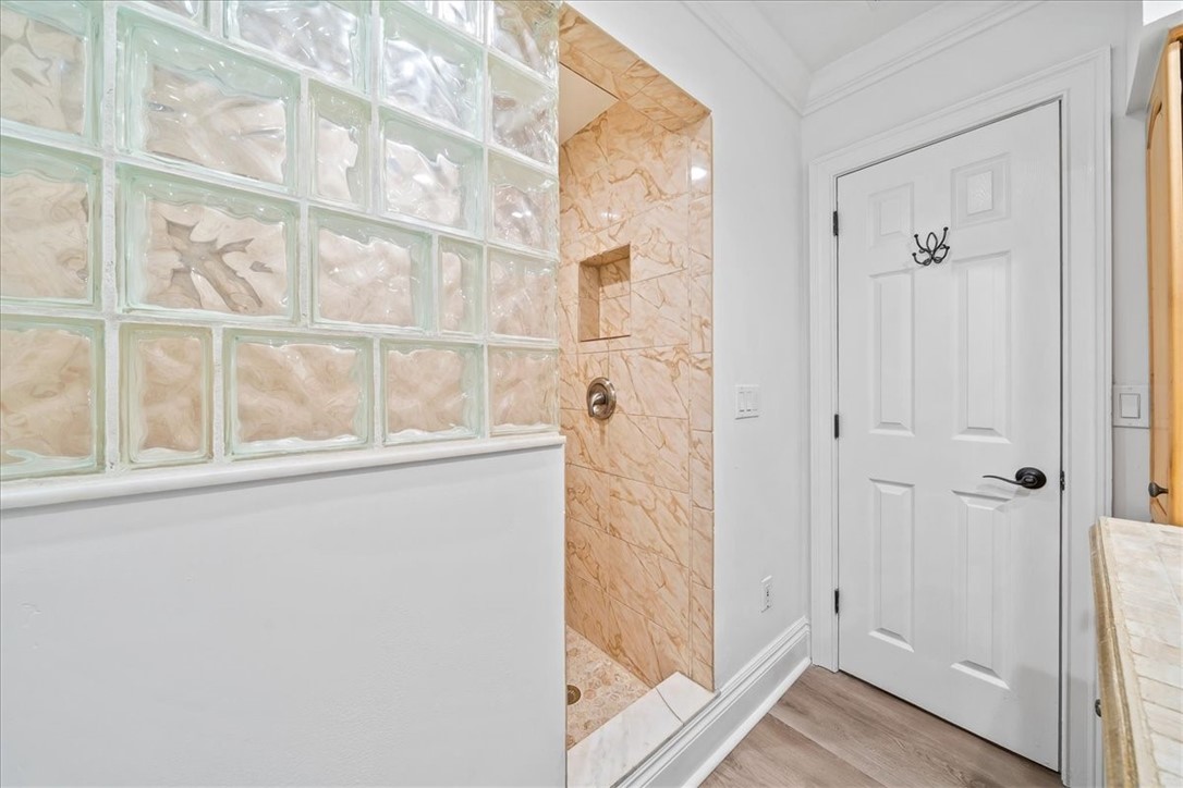 9670 Mockingbird Lane Sebastian, FL 32976 - Photo 20 of 36 a view of a bathroom with a glass door