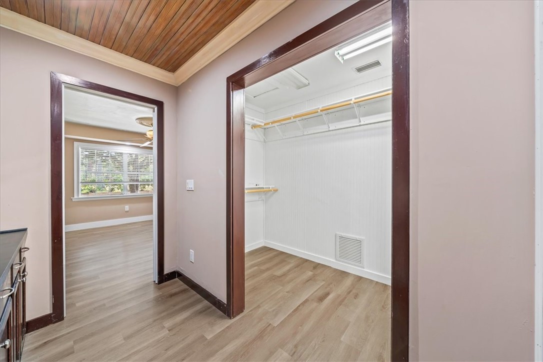 9670 Mockingbird Lane Sebastian, FL 32976 - Photo 23 of 36 a view of a hallway with wooden floor