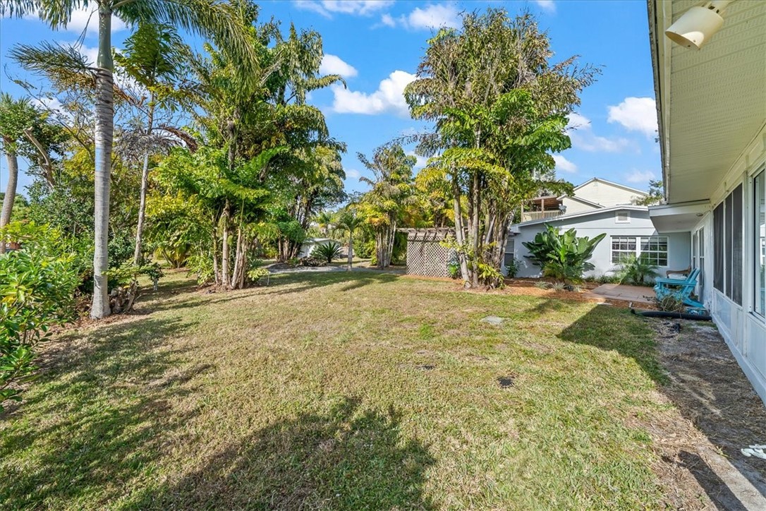 9670 Mockingbird Lane Sebastian, FL 32976 - Photo 27 of 36 a view of outdoor space with trees