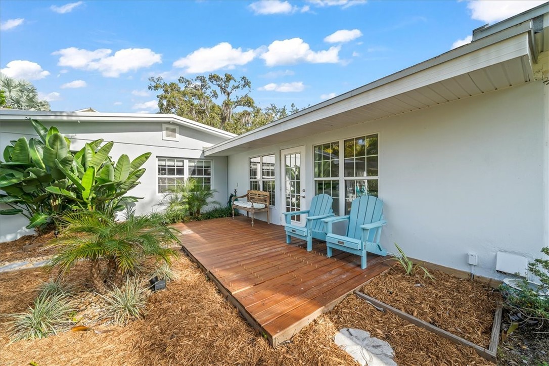 9670 Mockingbird Lane Sebastian, FL 32976 - Photo 28 of 36 a balcony with furniture and a potted plant