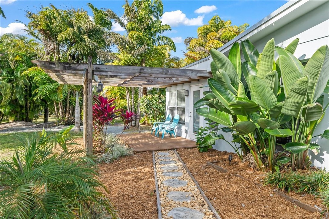 9670 Mockingbird Lane Sebastian, FL 32976 - Photo 29 of 36 a view of a yard with plants