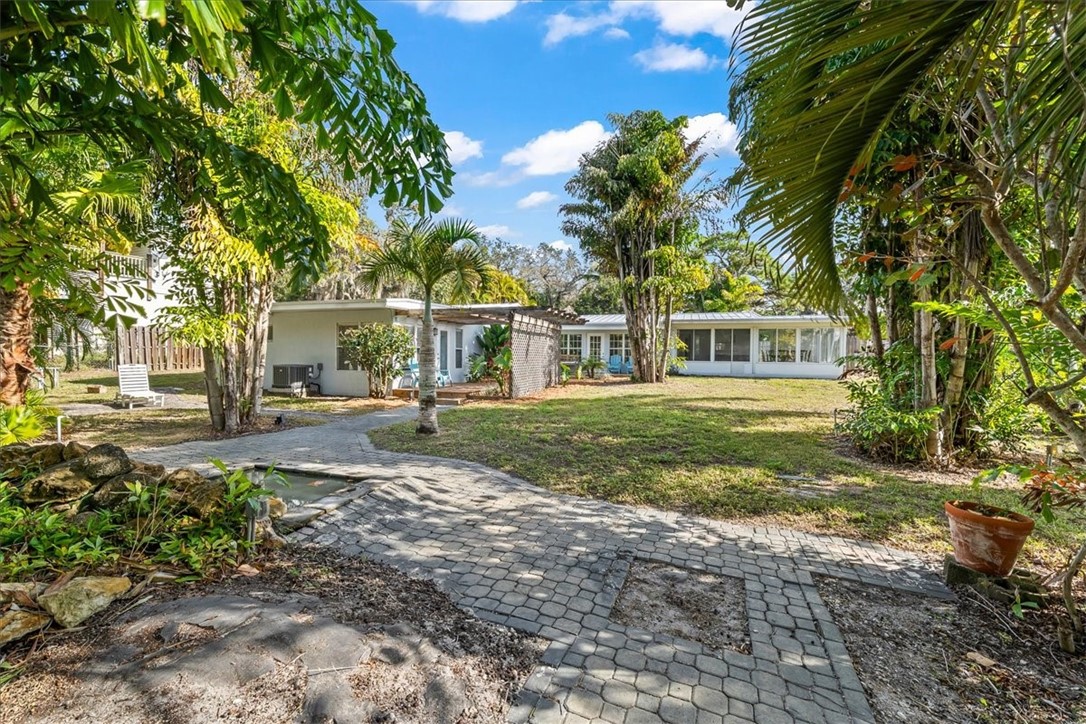 9670 Mockingbird Lane Sebastian, FL 32976 - Photo 30 of 36 a view of a house with a yard