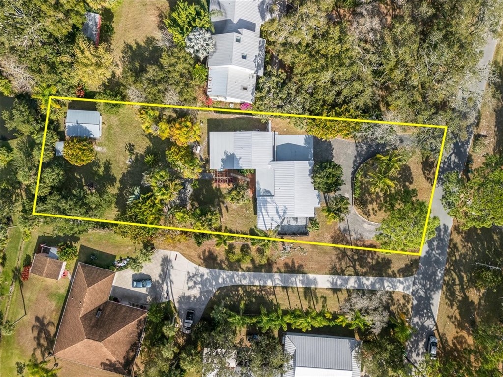9670 Mockingbird Lane Sebastian, FL 32976 - Photo 34 of 36 an aerial view of a house with a yard