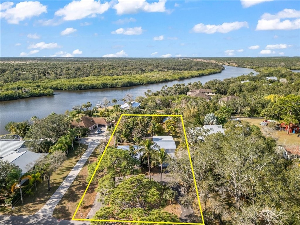 9670 Mockingbird Lane Sebastian, FL 32976 - Photo 35 of 36 a view of lake with city