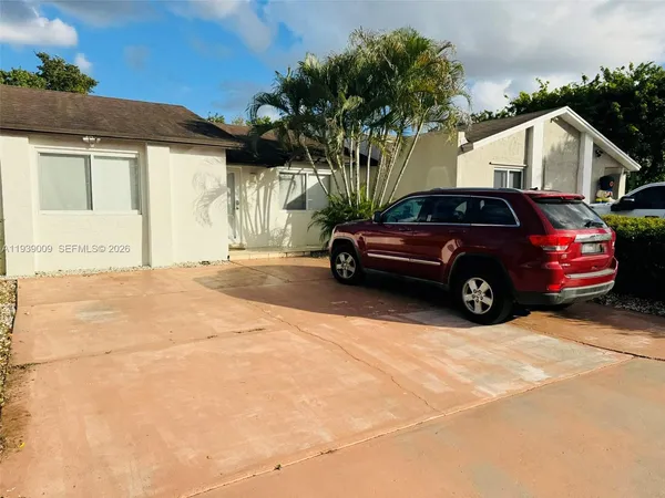 a car parked in front of a house
