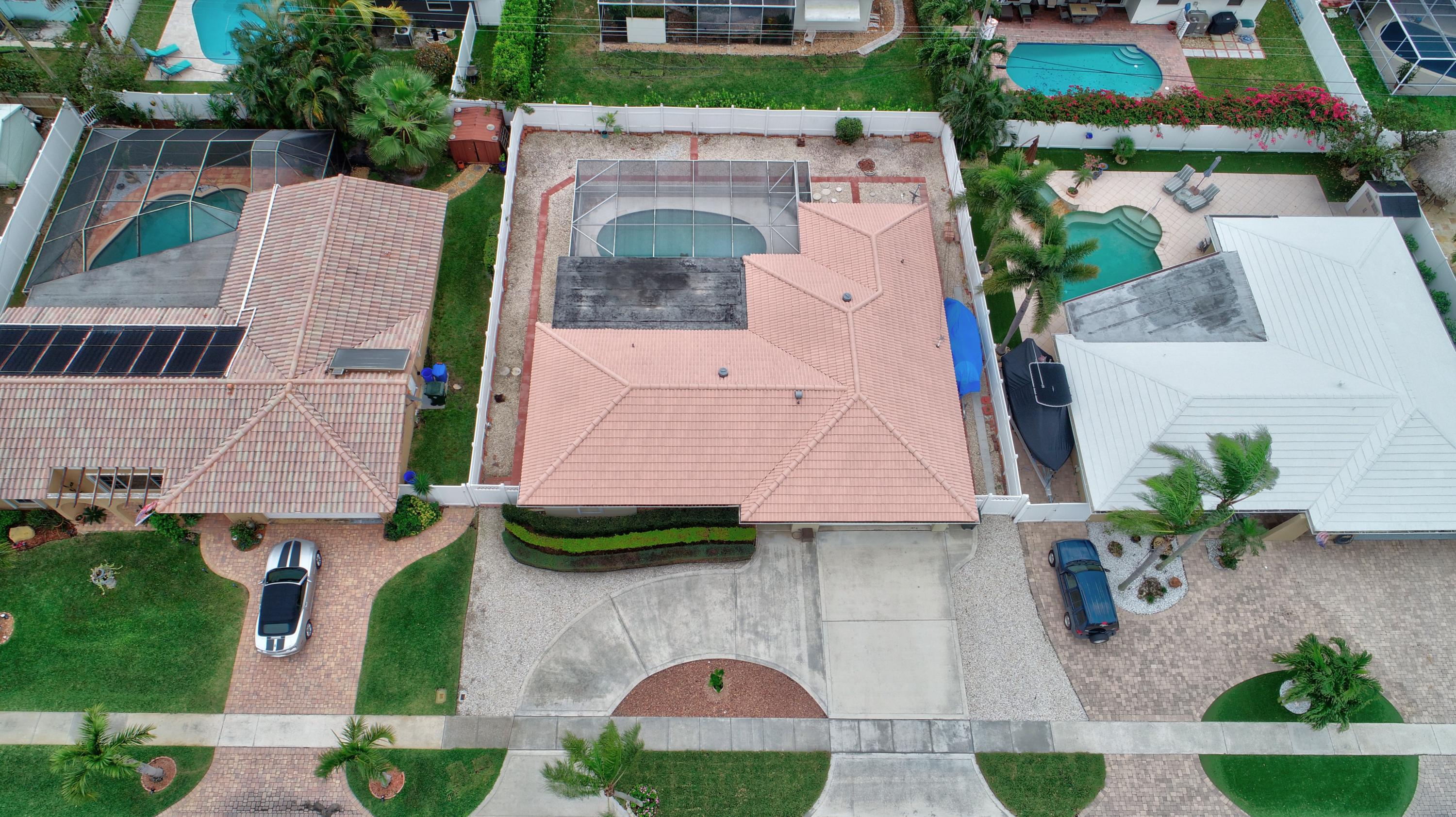 984 Southwest 3rd Street Boca Raton, FL 33486 - Photo 5 of 36 an aerial view of a house with garden space and a car park in front of it