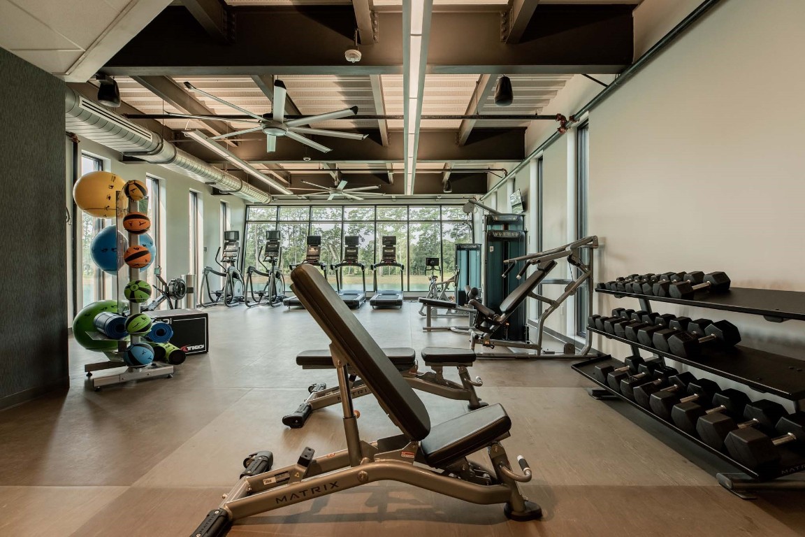 295 Sierra Stream Lane Conroe, TX 77304 - Photo 15 of 16 a view of a room with gym equipment