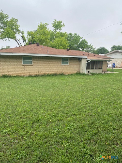 3905 Mariam Road Temple, TX 76502 - Photo 2 of 17 a backyard of a house with plants and large trees