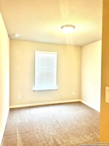 a view of a big room with a window