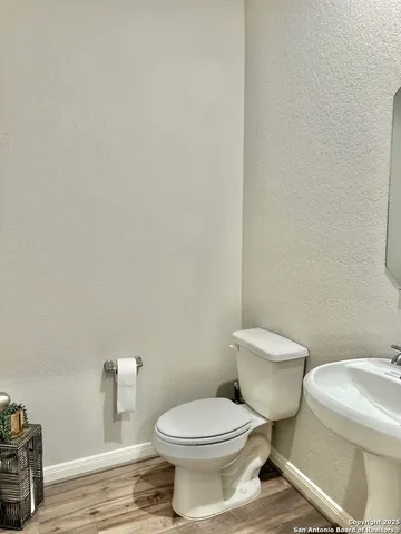 a white toilet sitting next to a white house