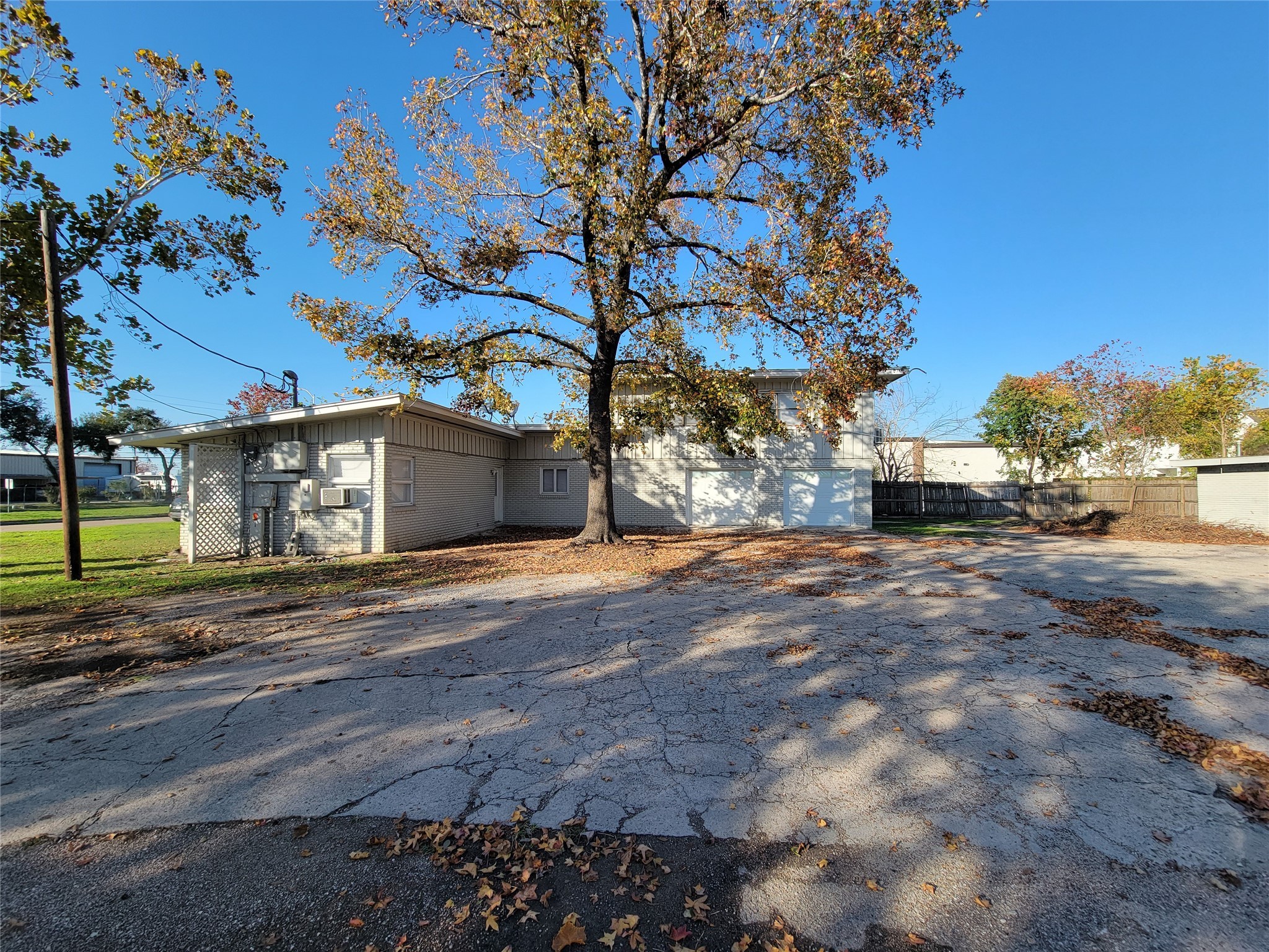 2320 Blalock Road Houston, TX 77080 - Photo 5 of 12 a front view of a house with a yard and garage