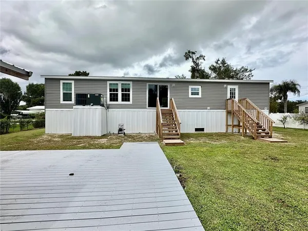 a front view of house with yard having seating