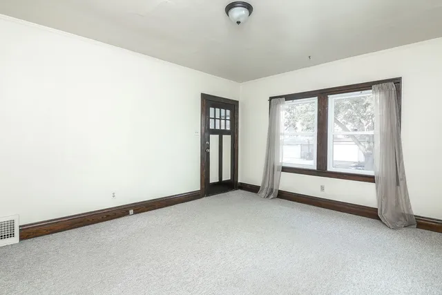 a view of an empty room with a window