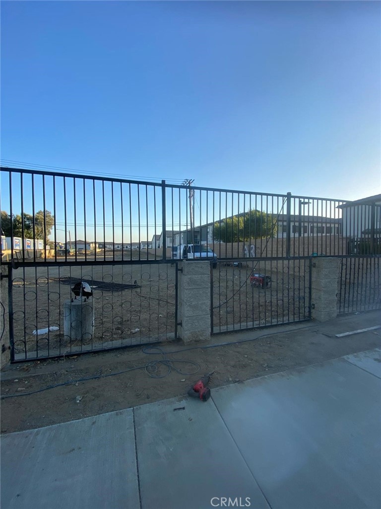 14043 Foothill Boulevard Fontana, CA 92335 - Photo 8 of 8 a view of a fence and a bench