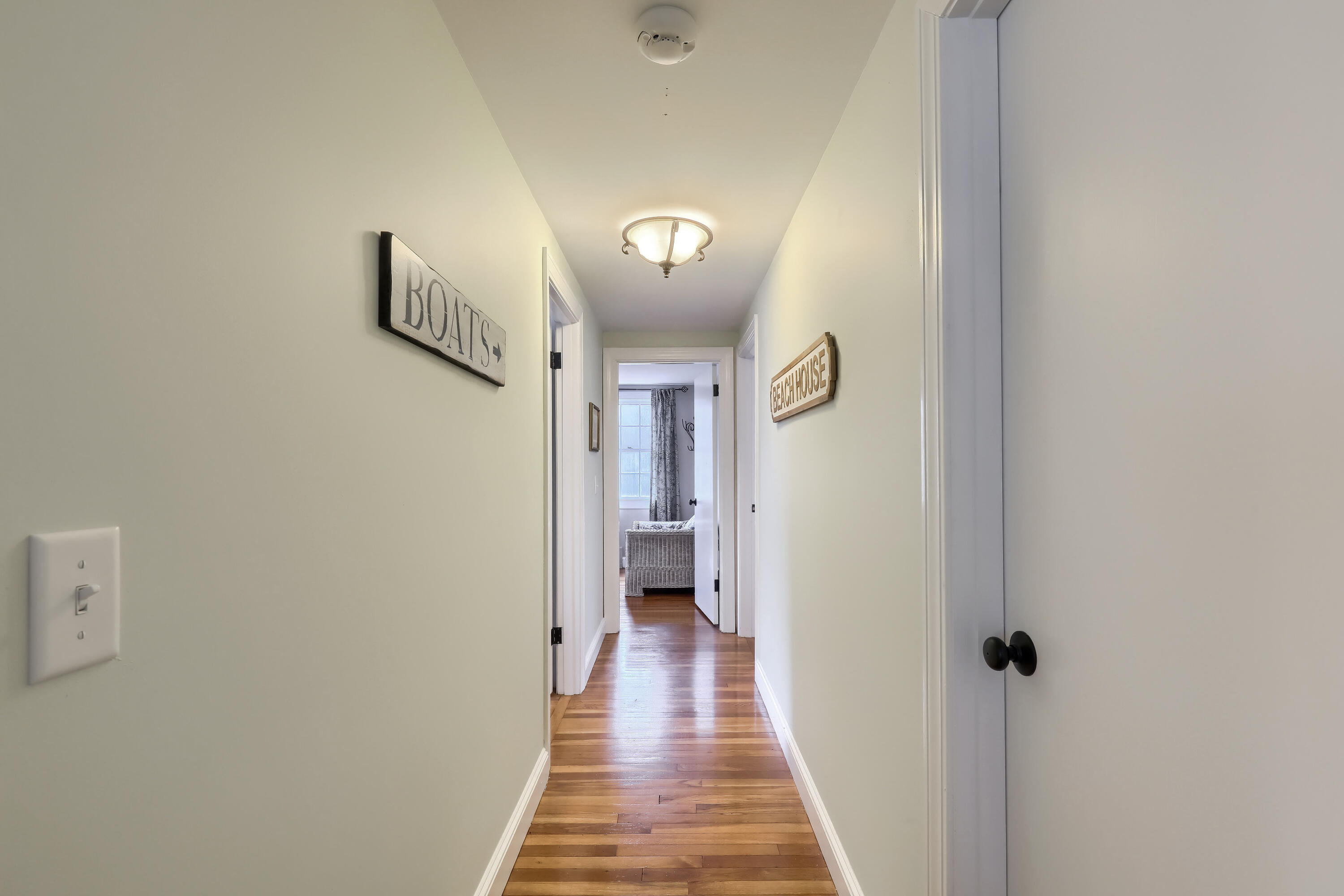 177 Old Stage Road Centerville, MA 02632 - Photo 14 of 29 a view of a hallway with wooden floor