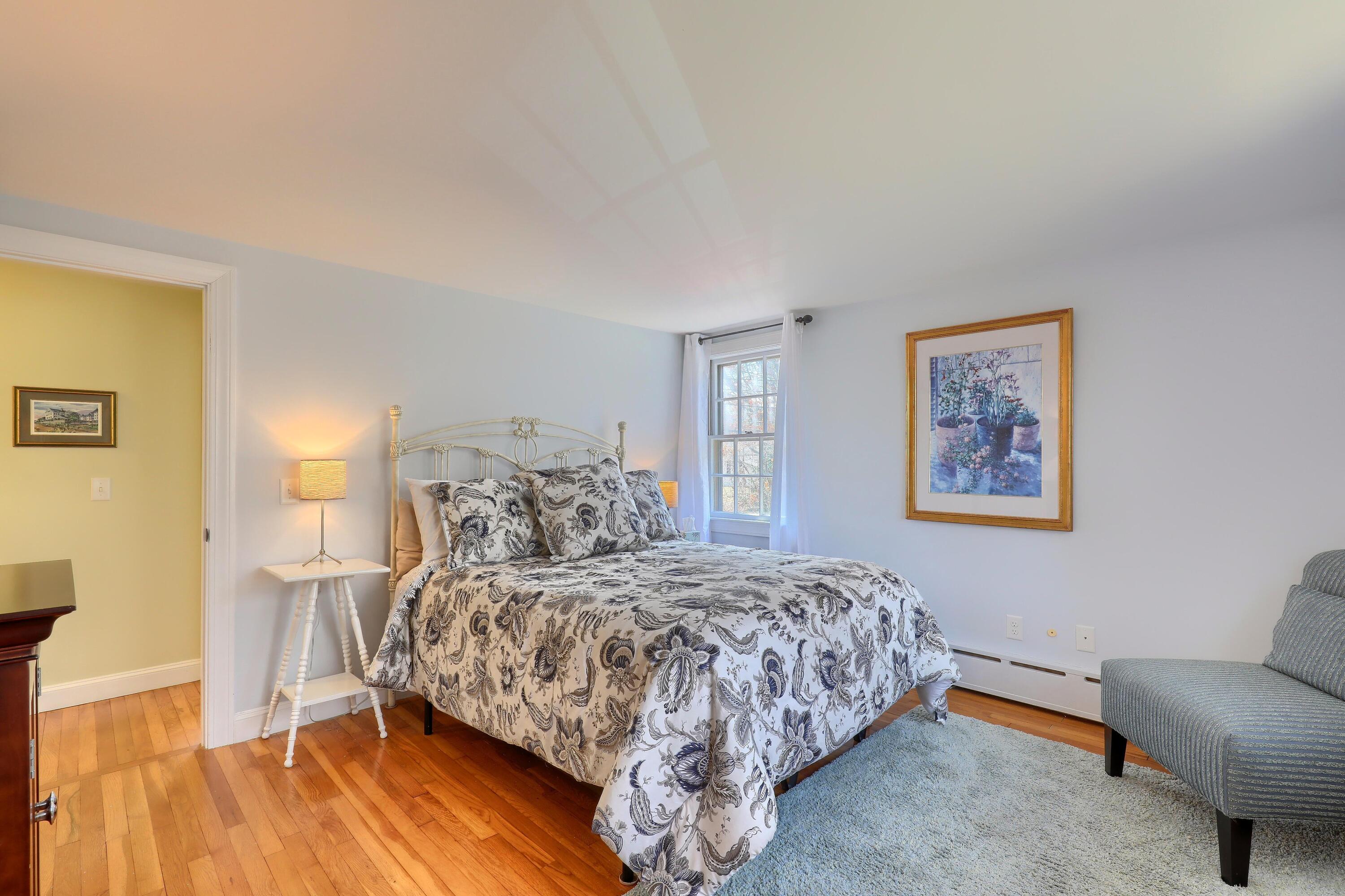 177 Old Stage Road Centerville, MA 02632 - Photo 16 of 29 a bedroom with a bed and wooden floor