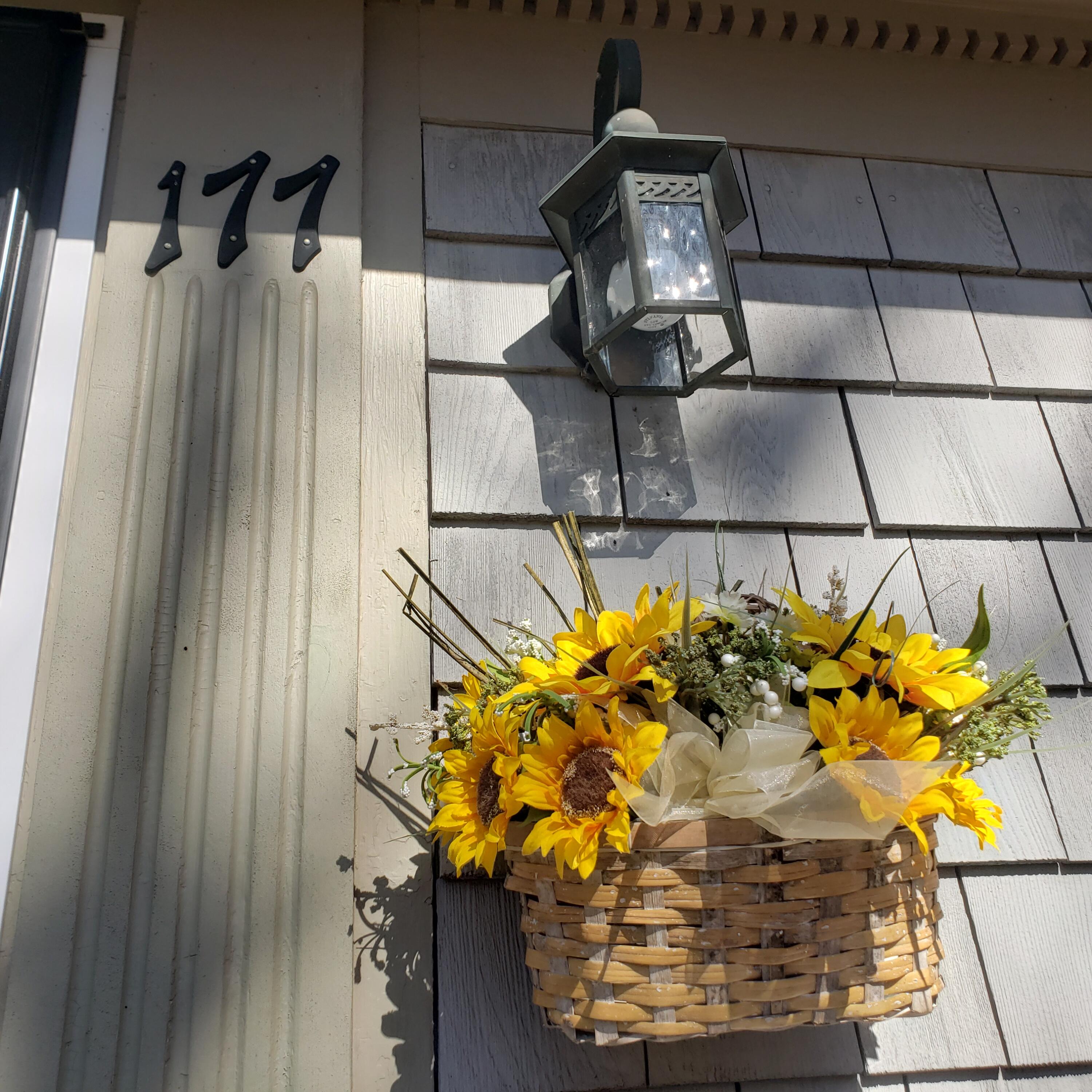177 Old Stage Road Centerville, MA 02632 - Photo 2 of 29 a vase of flowers sitting on a table