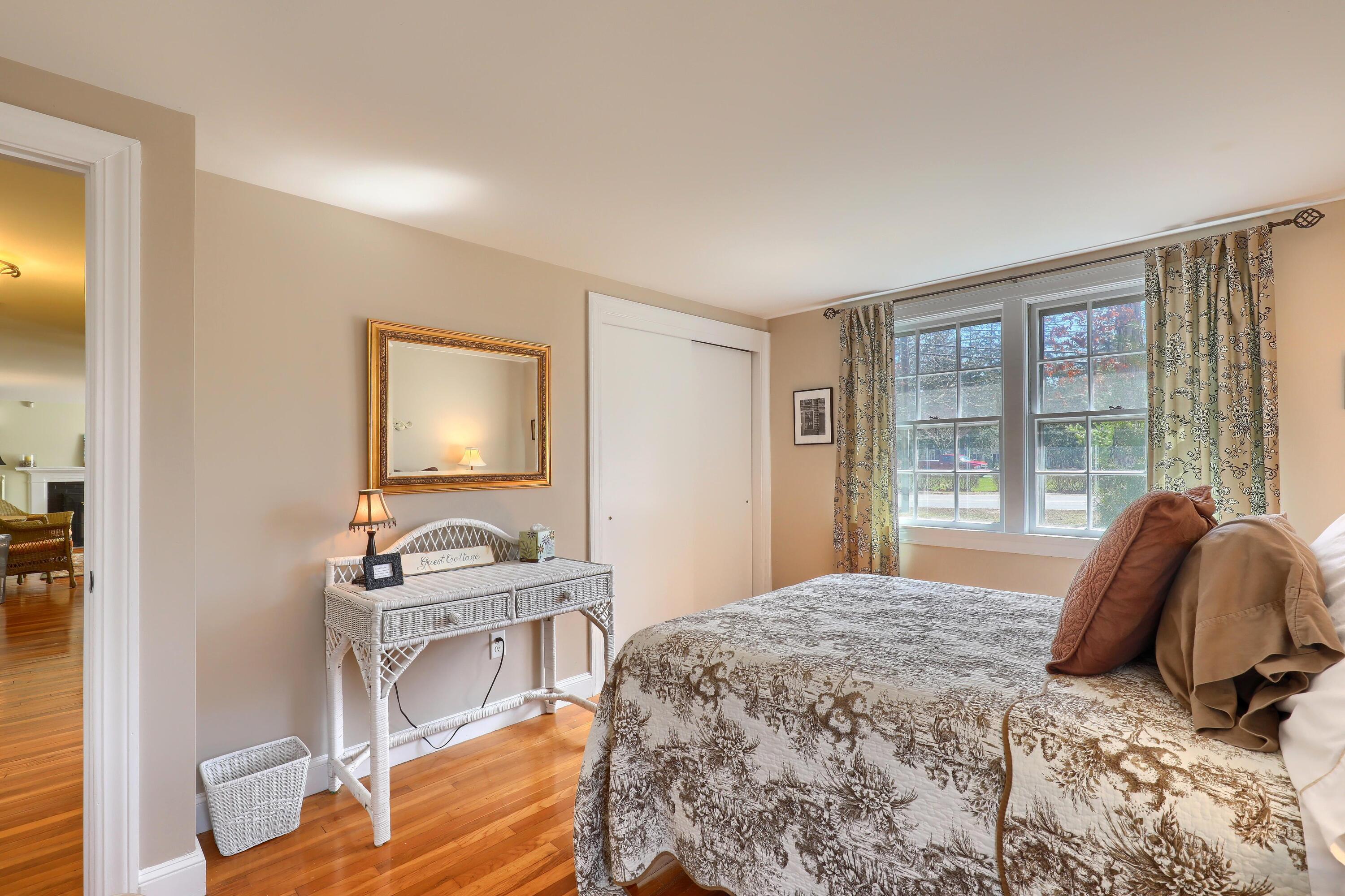 177 Old Stage Road Centerville, MA 02632 - Photo 22 of 29 a bedroom with a bed and a mirror