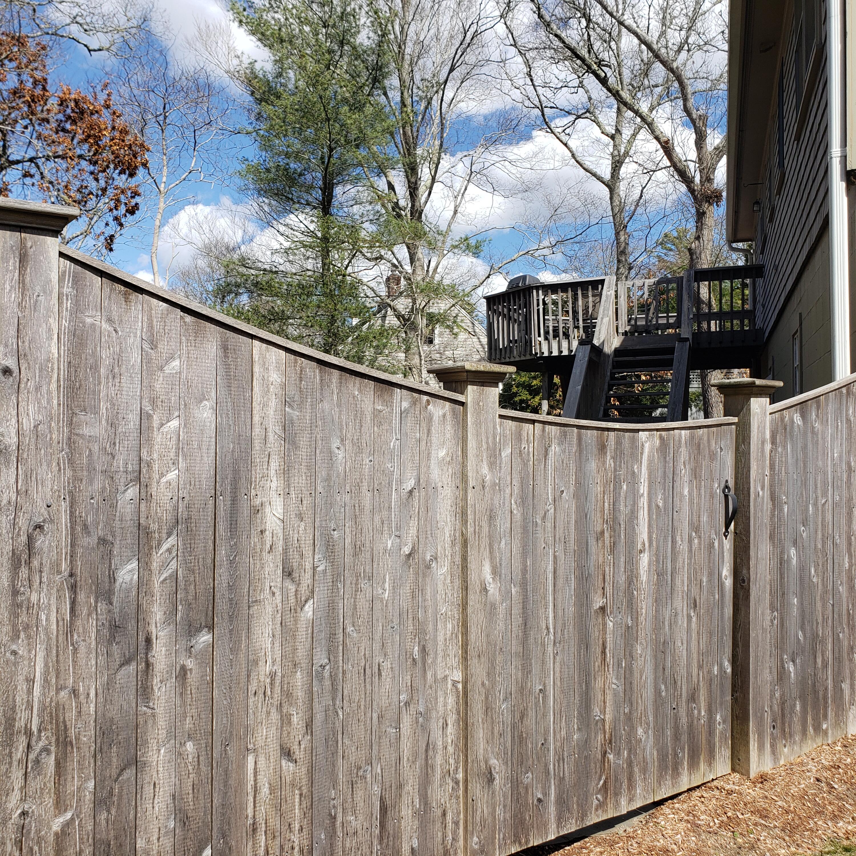 177 Old Stage Road Centerville, MA 02632 - Photo 25 of 29 a view of a wooden fence next to a large tree