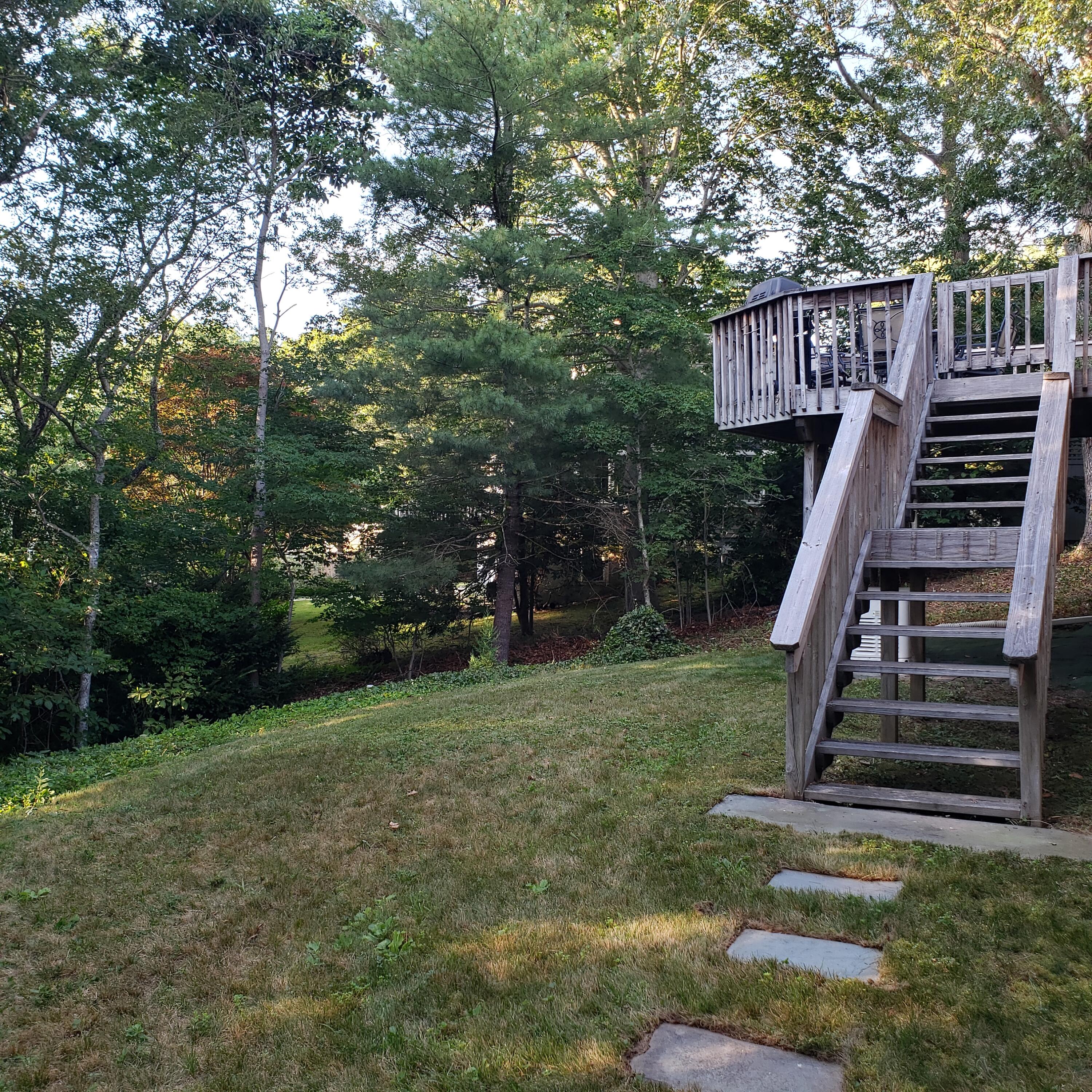 177 Old Stage Road Centerville, MA 02632 - Photo 26 of 29 a view of a house with backyard and deck