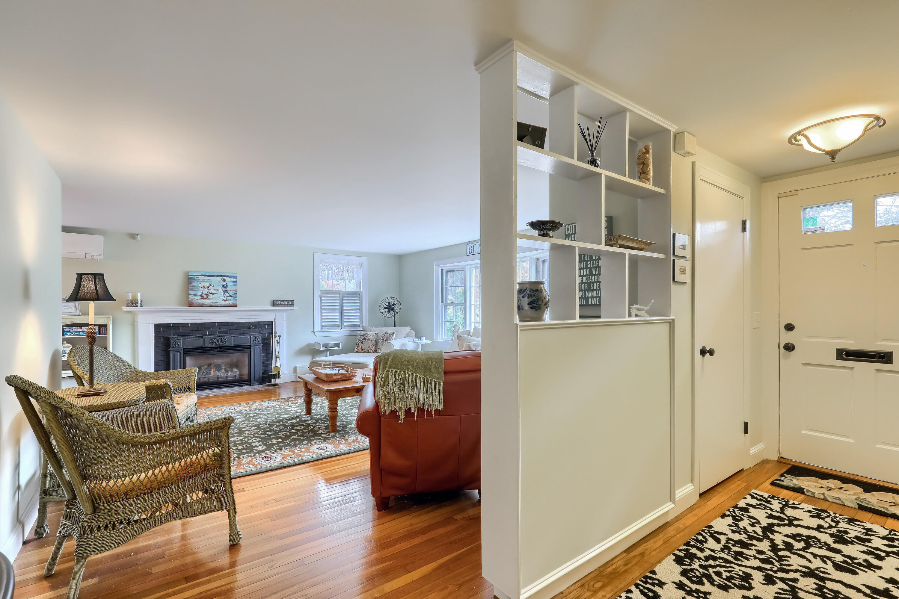177 Old Stage Road Centerville, MA 02632 - Photo 5 of 29 a living room with furniture and fireplace
