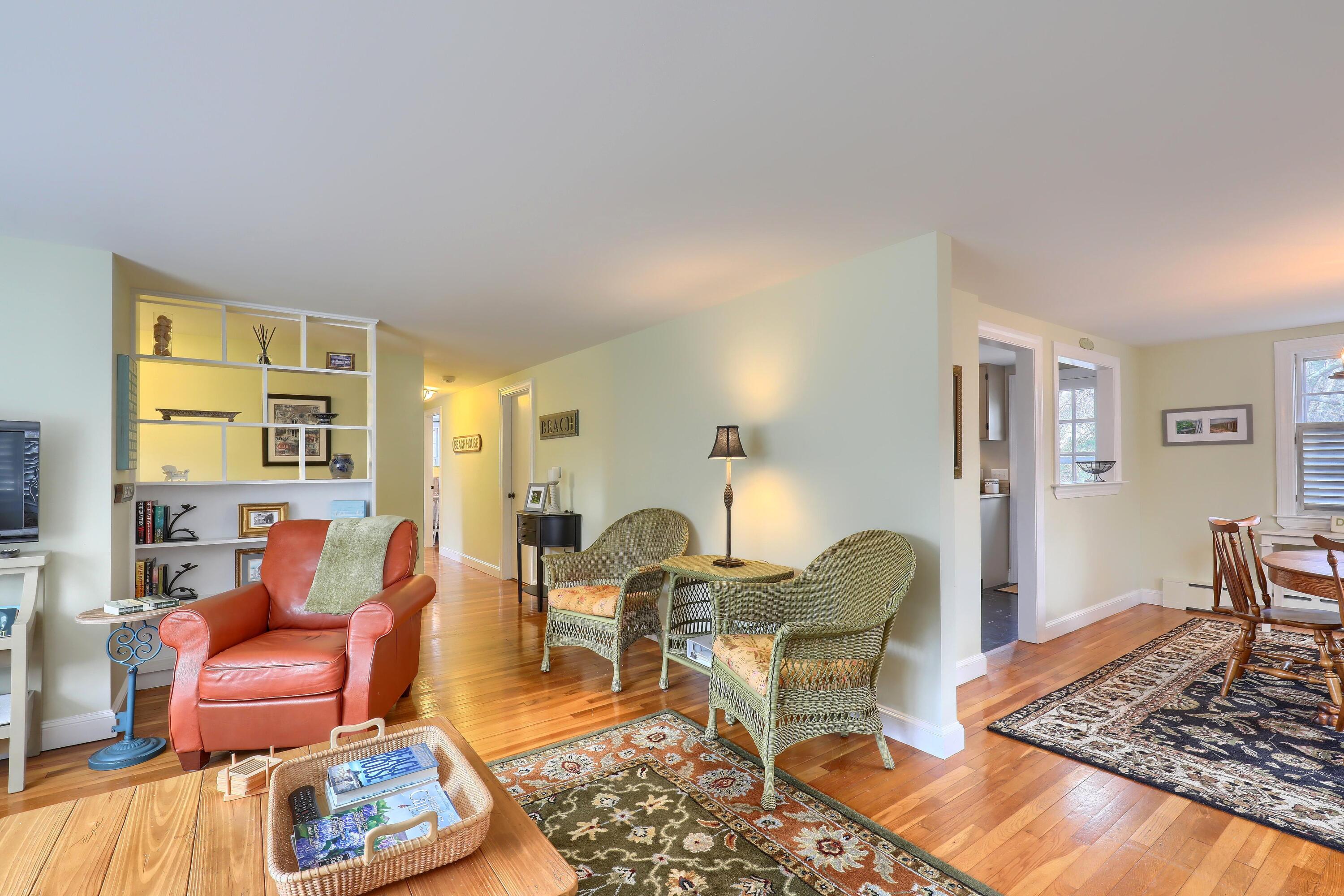 177 Old Stage Road Centerville, MA 02632 - Photo 8 of 29 a living room with furniture and a table