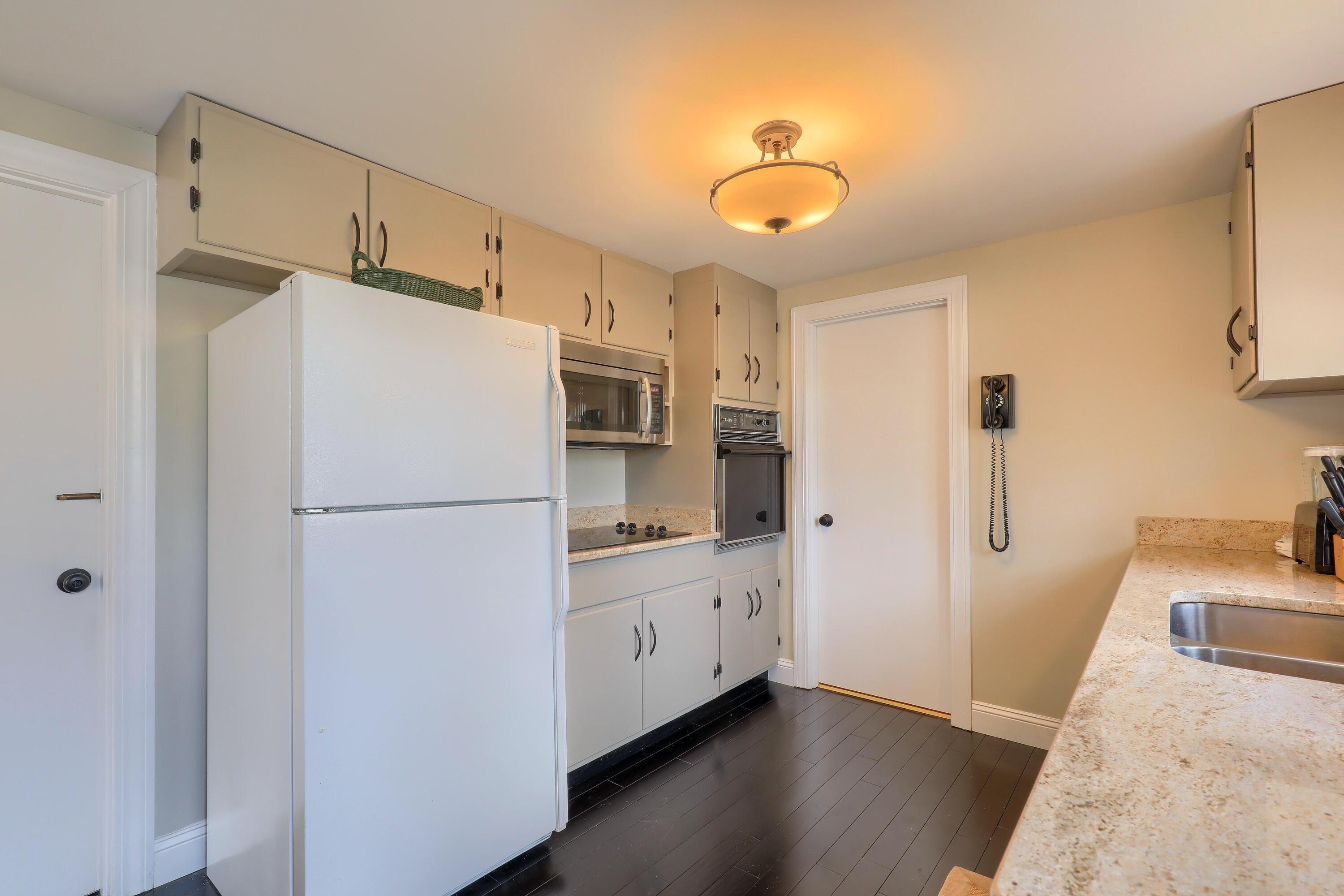 177 Old Stage Road Centerville, MA 02632 - Photo 10 of 29 a white refrigerator freezer sitting in a kitchen