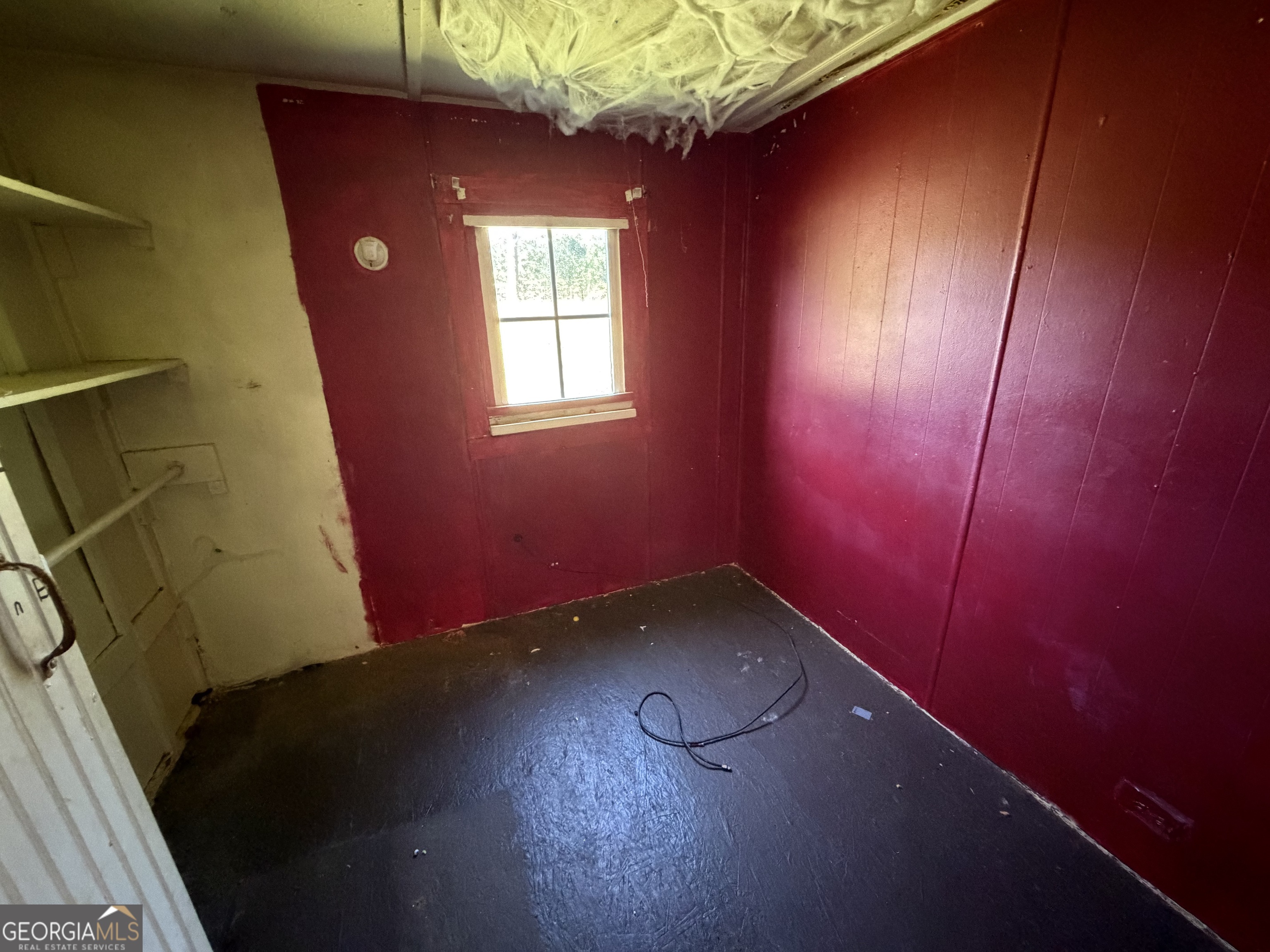 265 Aldora Street Barnesville, GA 30204 - Photo 6 of 9 a view of an empty room with a window